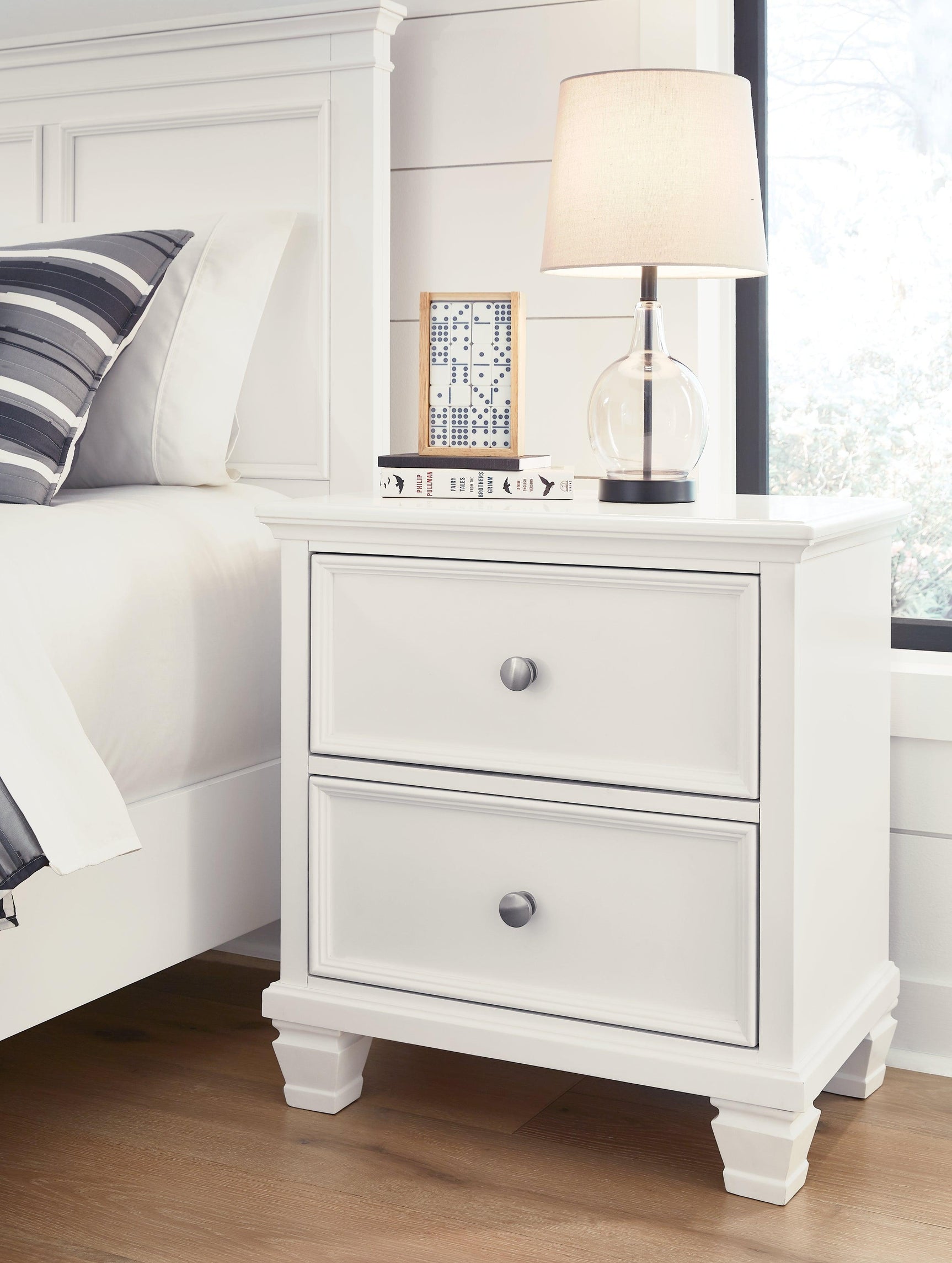 Fortman White Nightstand display in bedroom setting