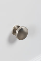 Close-up of satin nickel-tone round drawer knobs