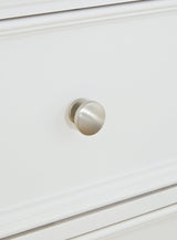 Close-up of satin nickel round drawer knob