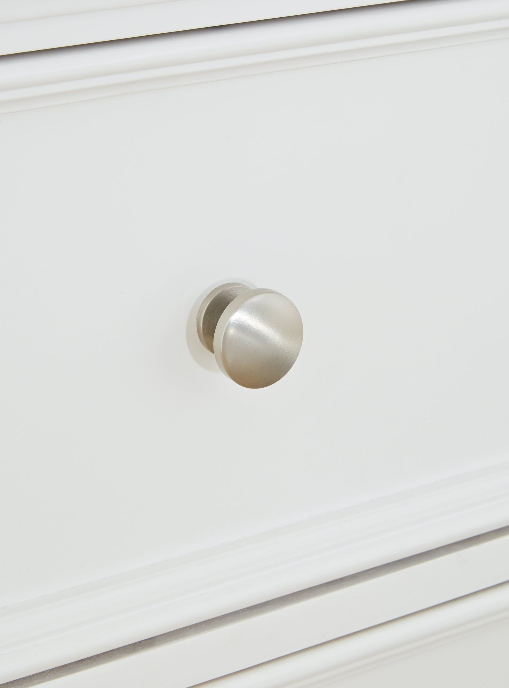 Close-up of satin nickel round drawer knob