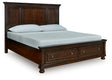 Porter rustic brown king storage sleigh bed showing paneled headboard and bun feet
