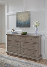 Close-up of Lettner Dresser silvertone hardware and light gray finish