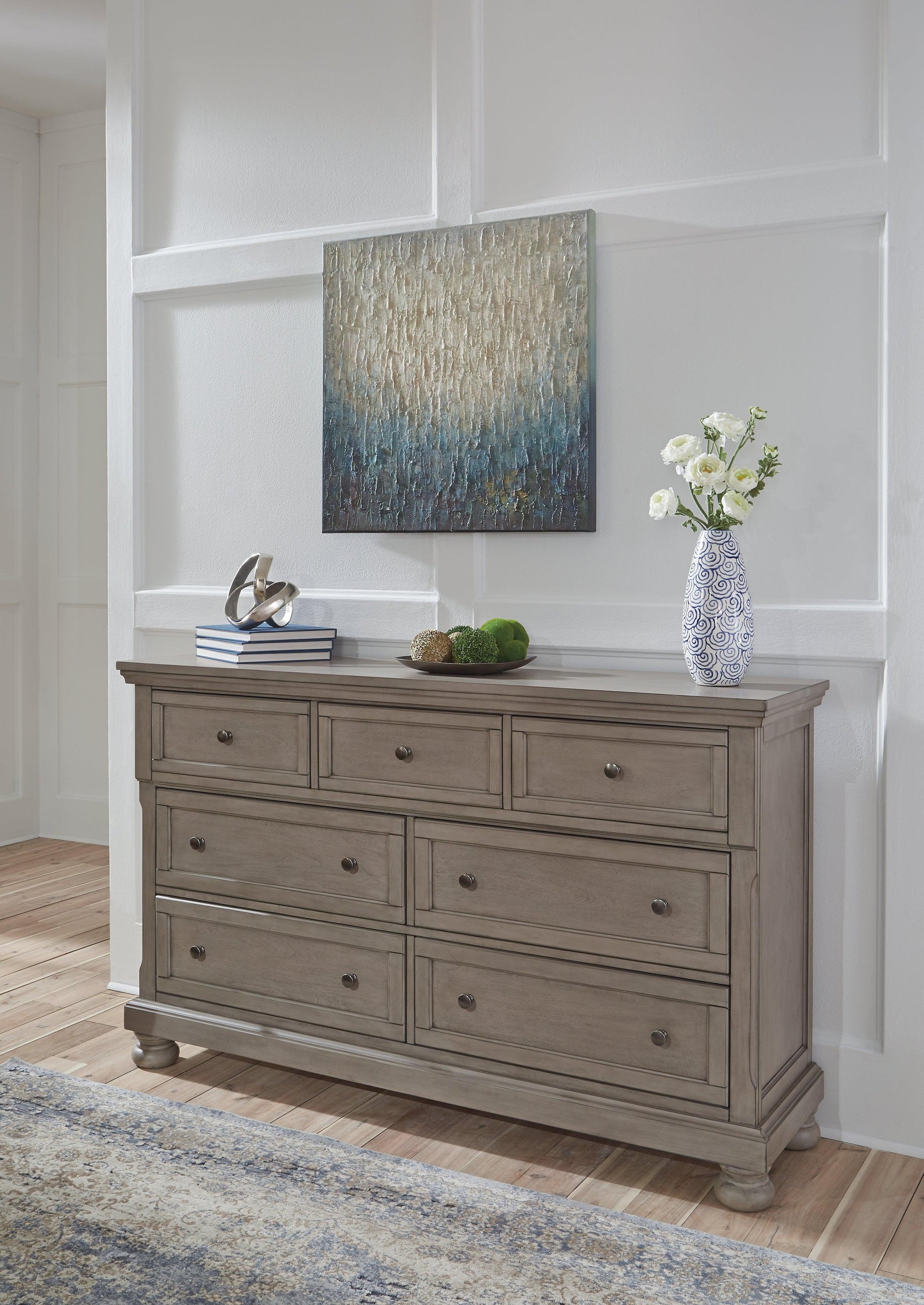 Close-up of Lettner Dresser silvertone hardware and light gray finish