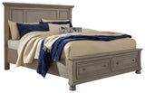 Side angle of Lettner Light Gray King Panel Storage Bed showing storage drawers