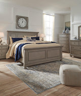 Detail of panel bed's inlaid wood panel and upholstery