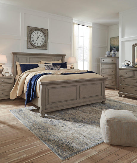 Detail of panel bed's inlaid wood panel and upholstery
