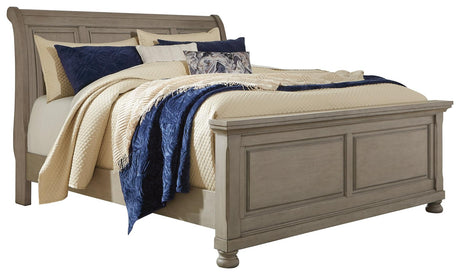 Side view of Lettner Light Gray King Sleigh Bed showing panel footboard