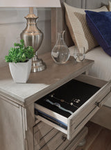 Detail of silvertone patina hardware and inlaid panel