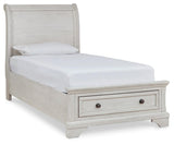 Side angle of Robbinsdale antique white twin sleigh storage bed