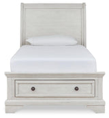 Front view of Robbinsdale twin sleigh storage bed with drawers closed