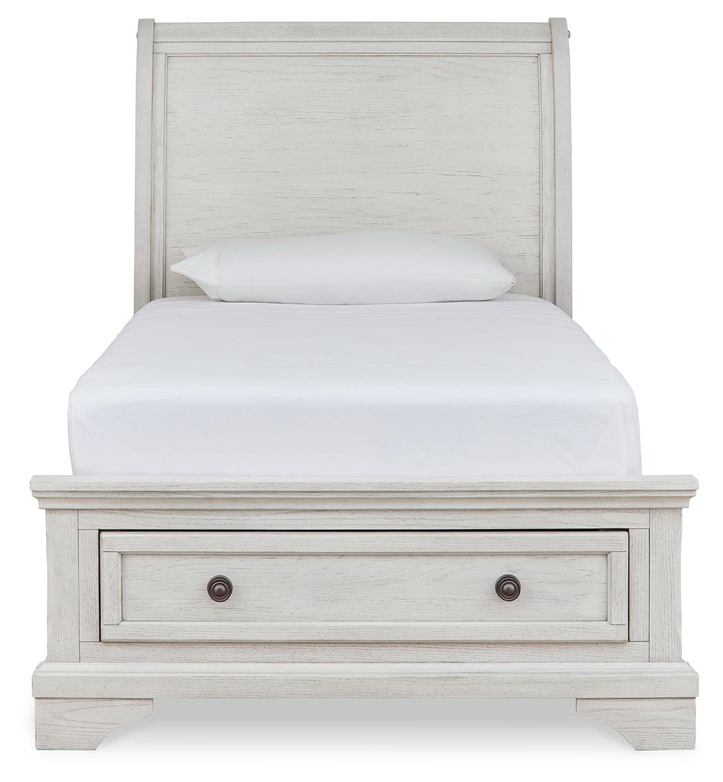Front view of Robbinsdale twin sleigh storage bed with drawers closed