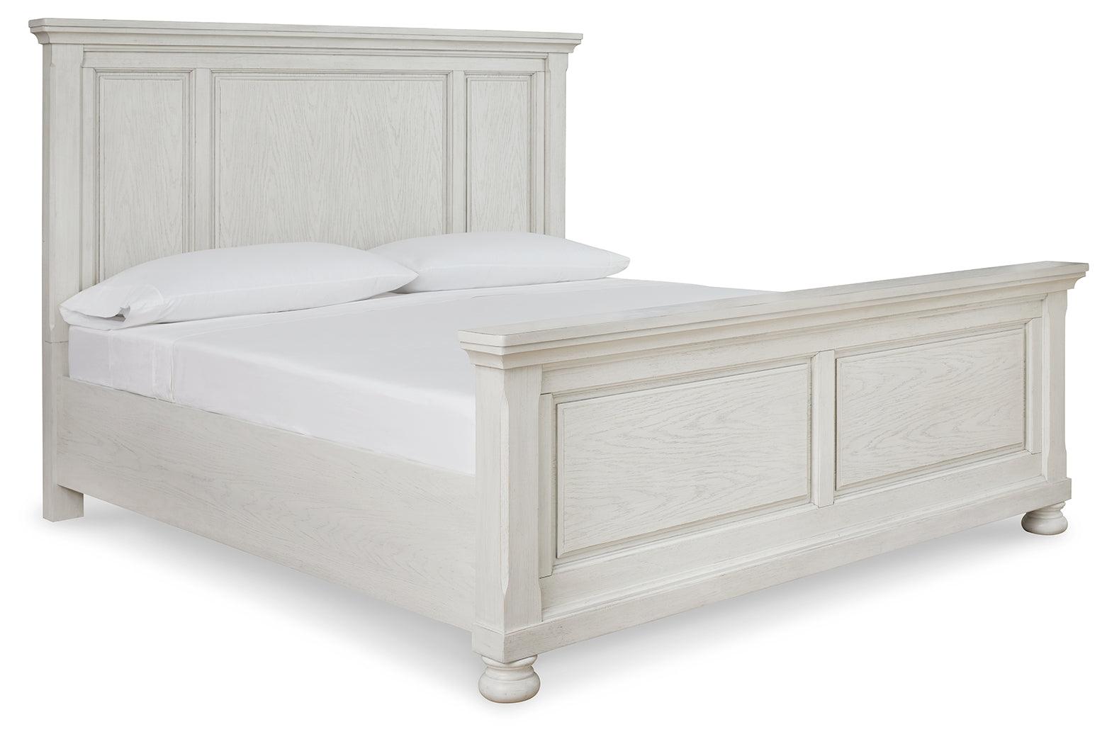 Side view of Robbinsdale Antique White King Panel Bed highlighting panel footboard