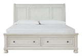 Robbinsdale Antique White Queen Sleigh Bed footboard with storage drawers