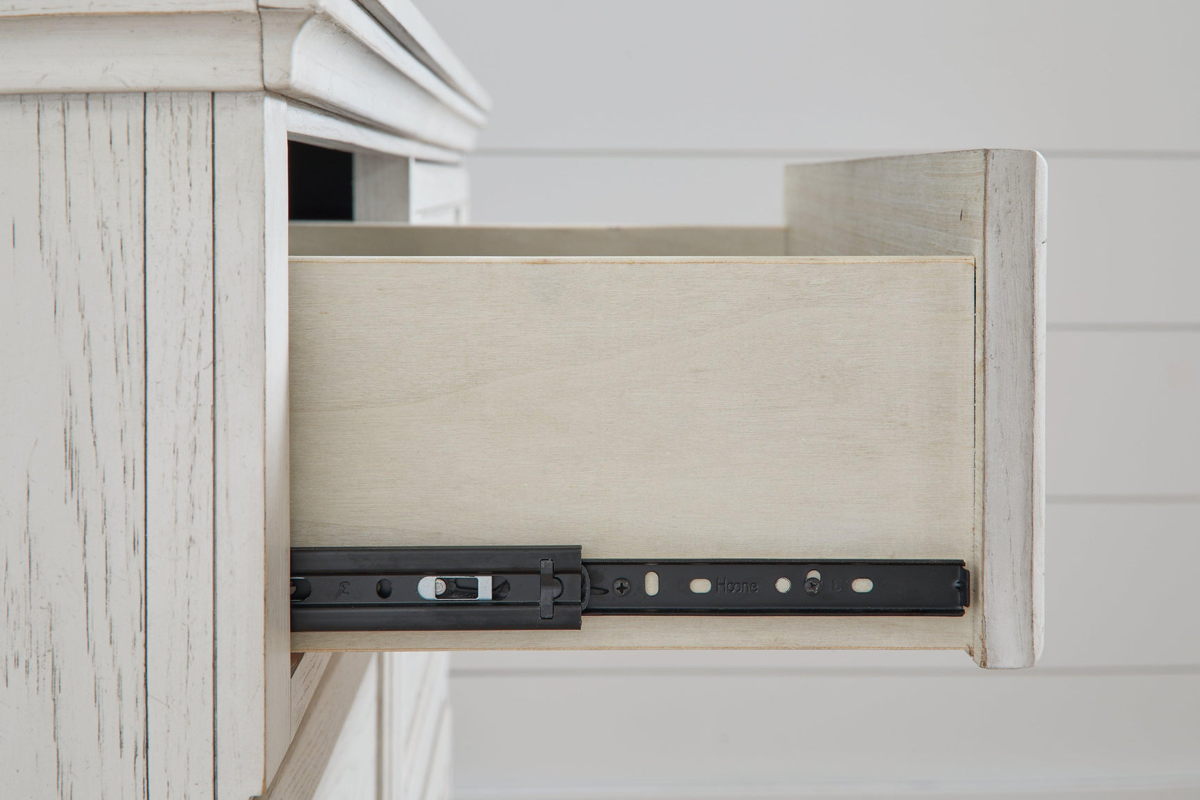 Robbinsdale Antique White Nightstand drawer glide detail