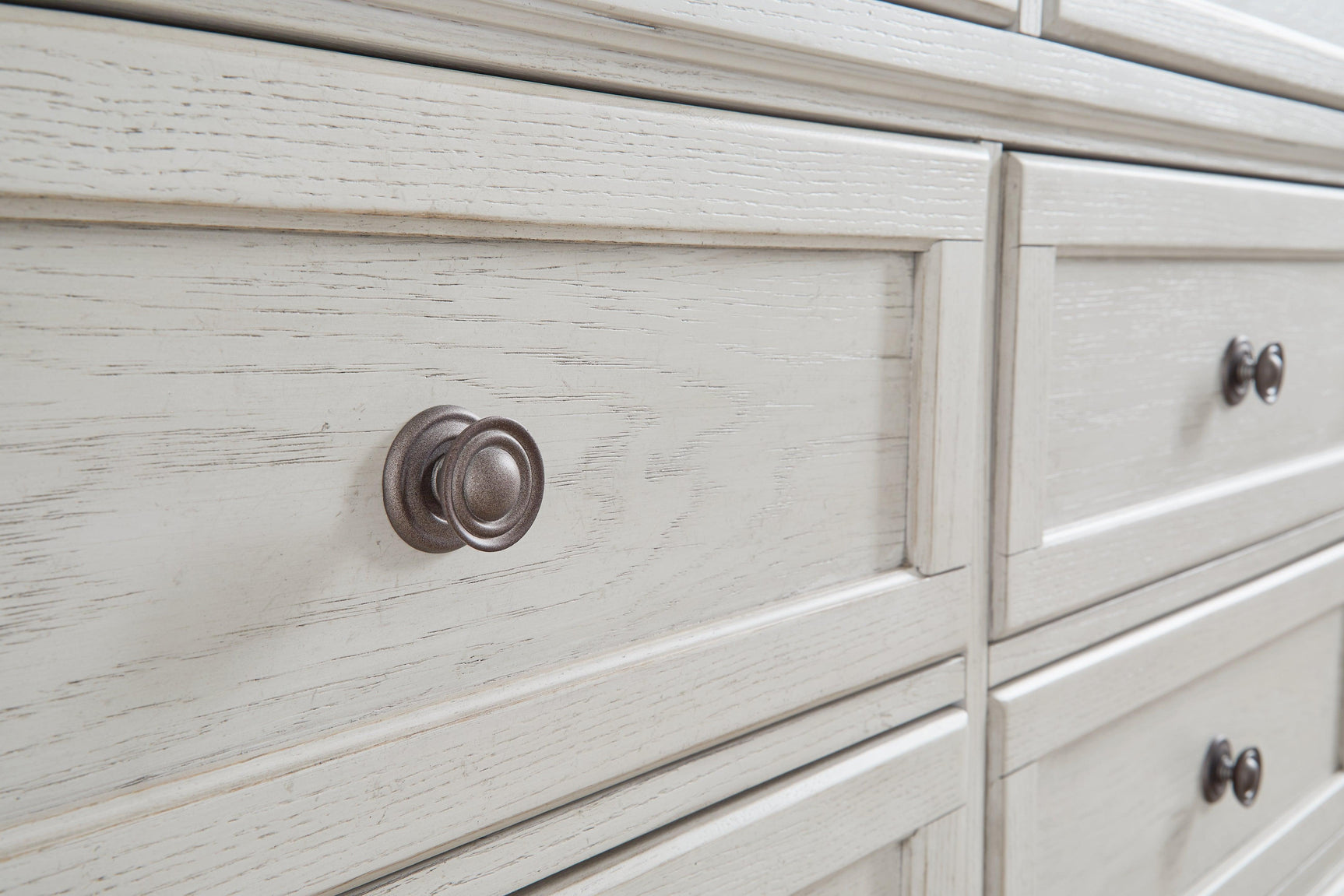 Close-up of dark bronze-tone knobs on Robbinsdale Dresser