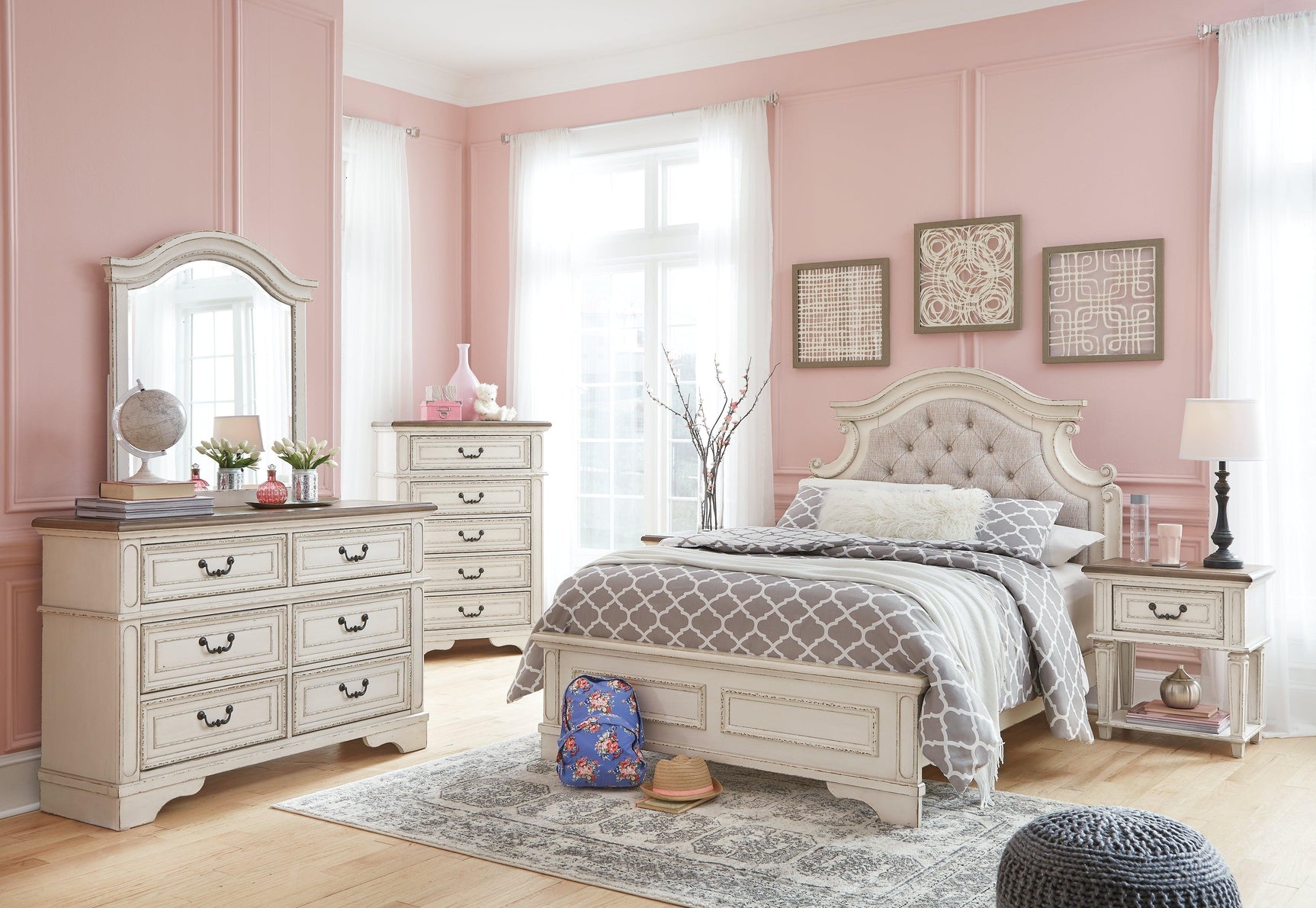Bedroom setting with Realyn Full Upholstered Panel Bed