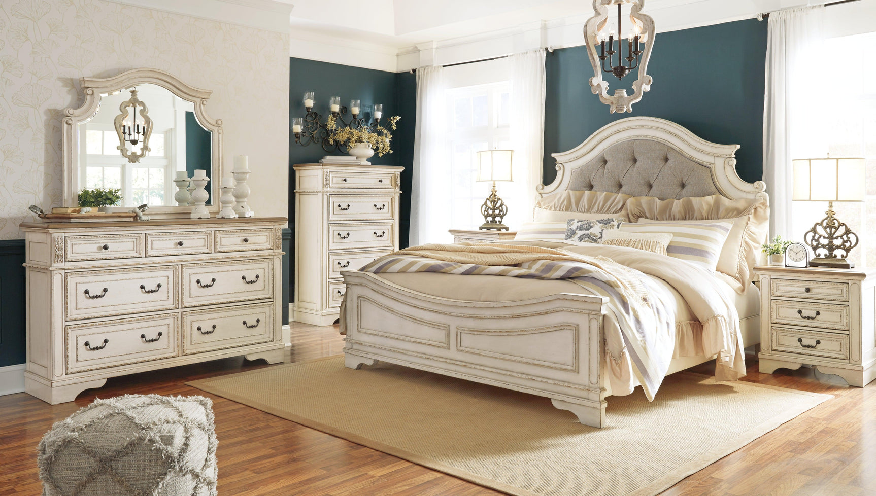 Side angle of Realyn Chipped White King Upholstered Panel Bed