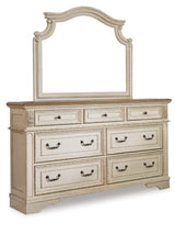 Close-up of Realyn dresser drawer with dark bronze hardware