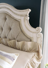 Close-up of chipped white distressed finish on bed frame