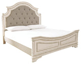 Detailed view of tufted headboard on Realyn Queen Upholstered Panel Bed