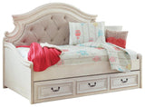 Side view of Realyn Chipped White Twin Daybed