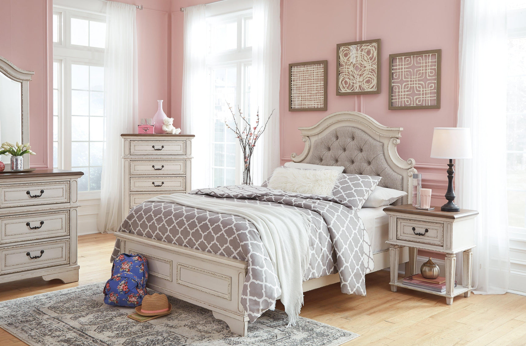 Another angle of Realyn Full Panel Bed highlighting button tufting
