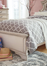 Footboard with chipped white finish and storage drawers