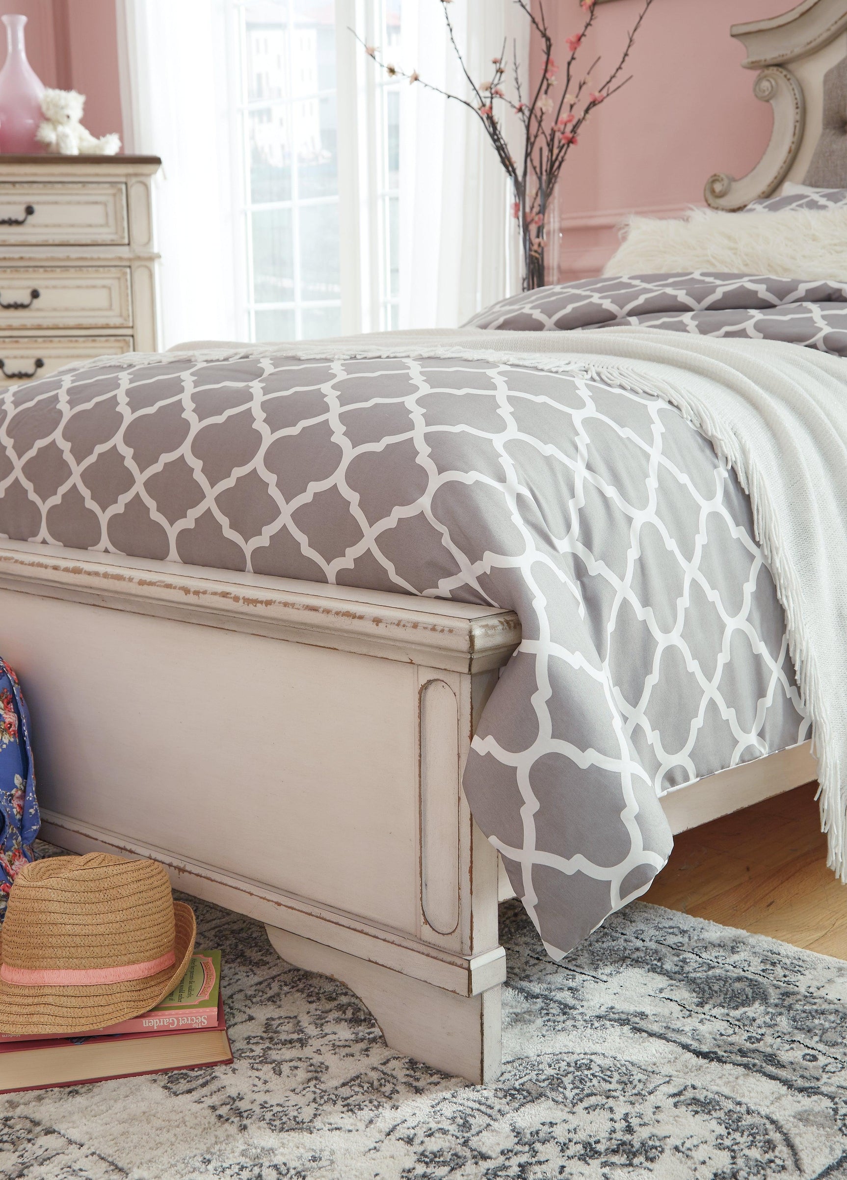 Footboard with chipped white finish and storage drawers