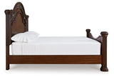 Side view showing sturdy hardwood posts of Lavinton King Poster Bed