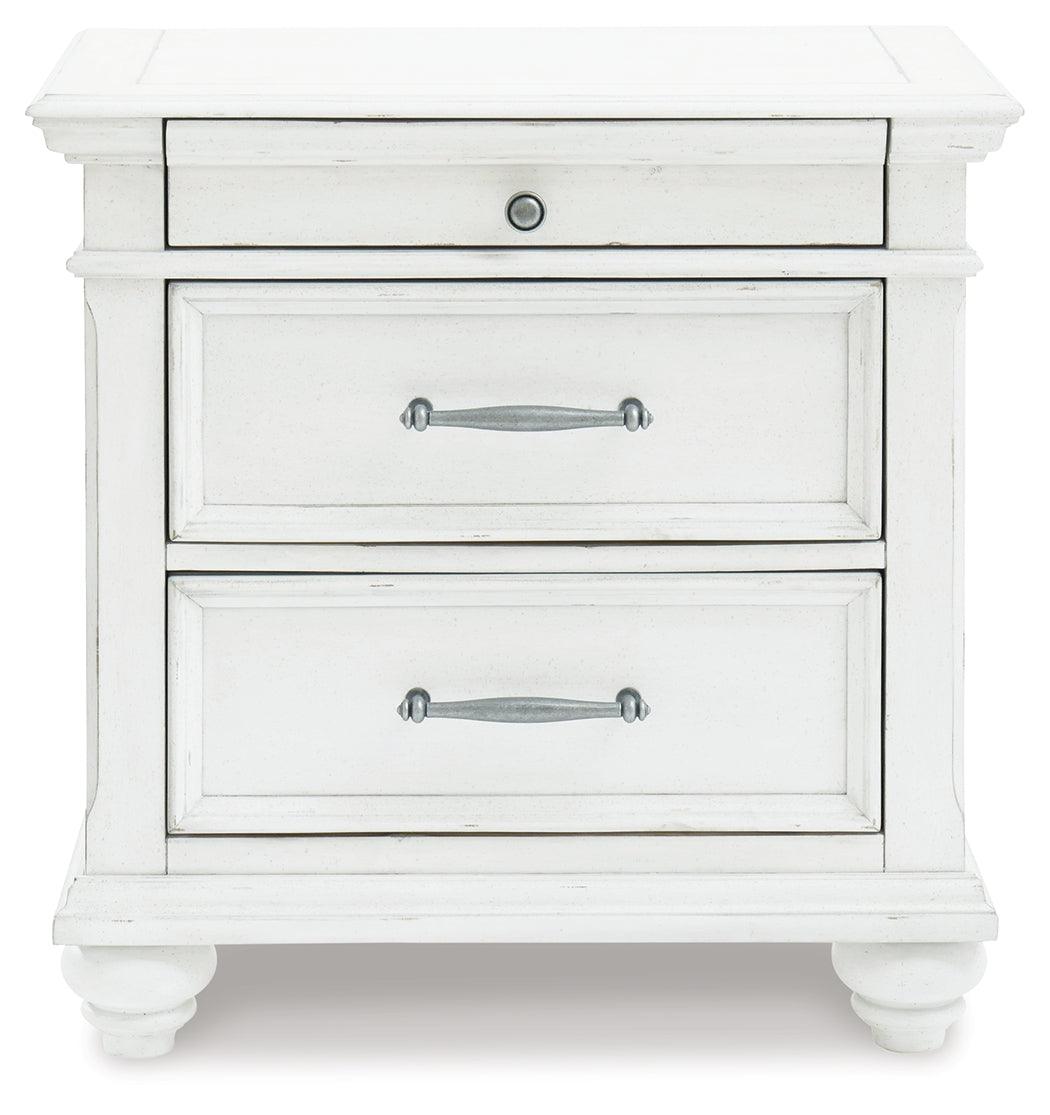 Kanwyn Whitewash Nightstand side view with bun feet