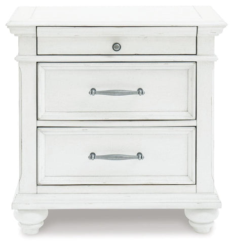 Kanwyn Whitewash Nightstand side view with bun feet