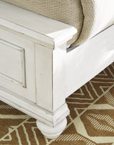 Detail of distressed whitewash finish on Kanwyn King Panel Bed wood