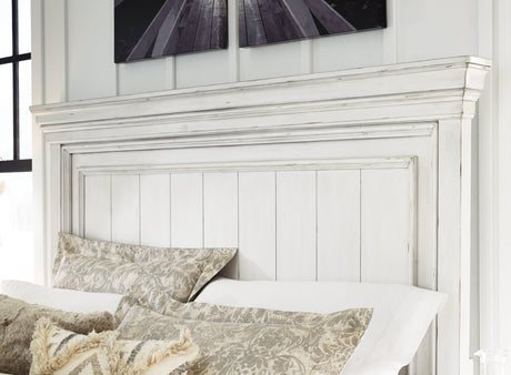 Side view of Kanwyn King Panel Bed showing bun feet and panel footboard