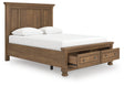 Feddinger queen panel storage bed in medium brown, angled front view