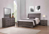 Side view of Coralee Gray Upholstered Sleigh Bedroom Set bed