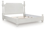 Rowlenstown antique white queen poster bed angled side view