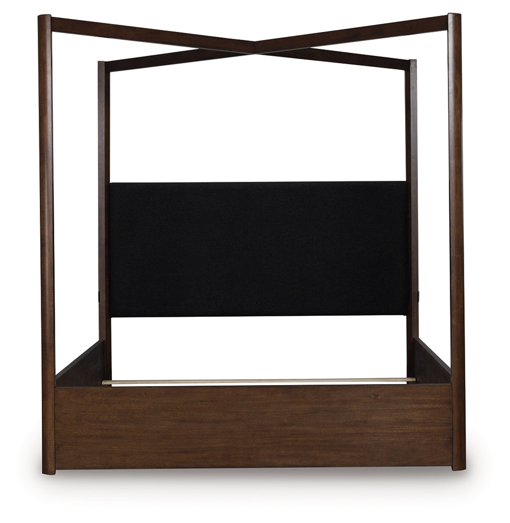 Side view of Dilenno dark brown king canopy bed