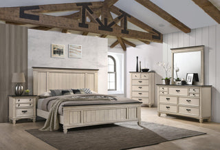 Close-up of upholstered cream headboard with brown accents