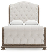 Ardenfield Queen Upholstered Sleigh Bed head-on view of tufted headboard