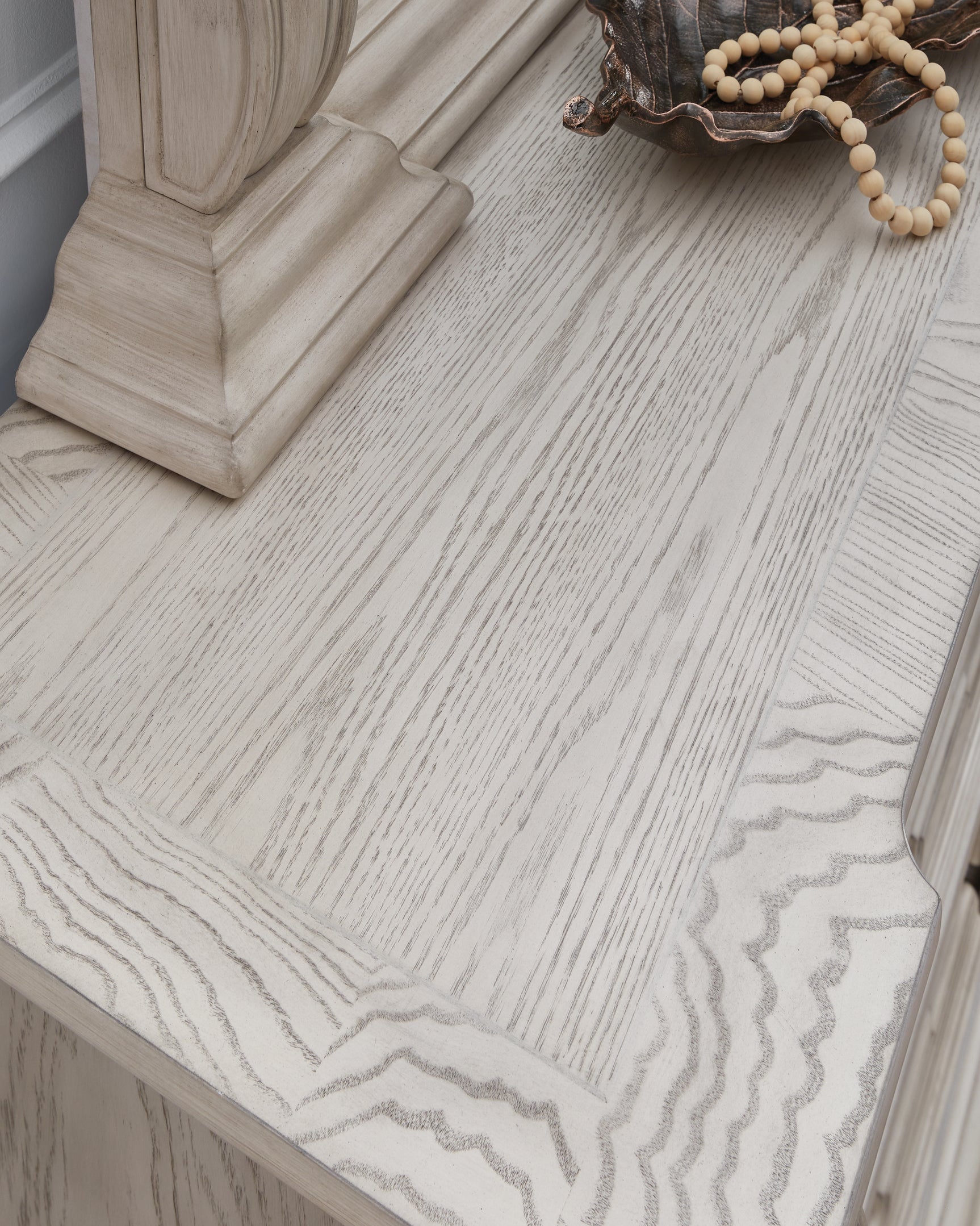 Top detail showing ash swirl border on dresser