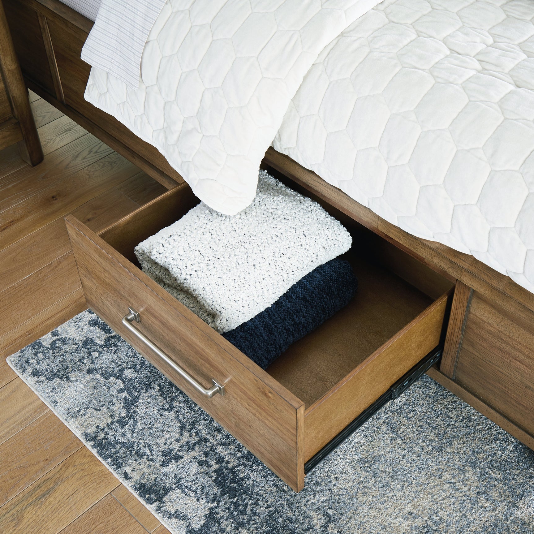 Close-up of natural wood grain texture on Cabalynn Bed