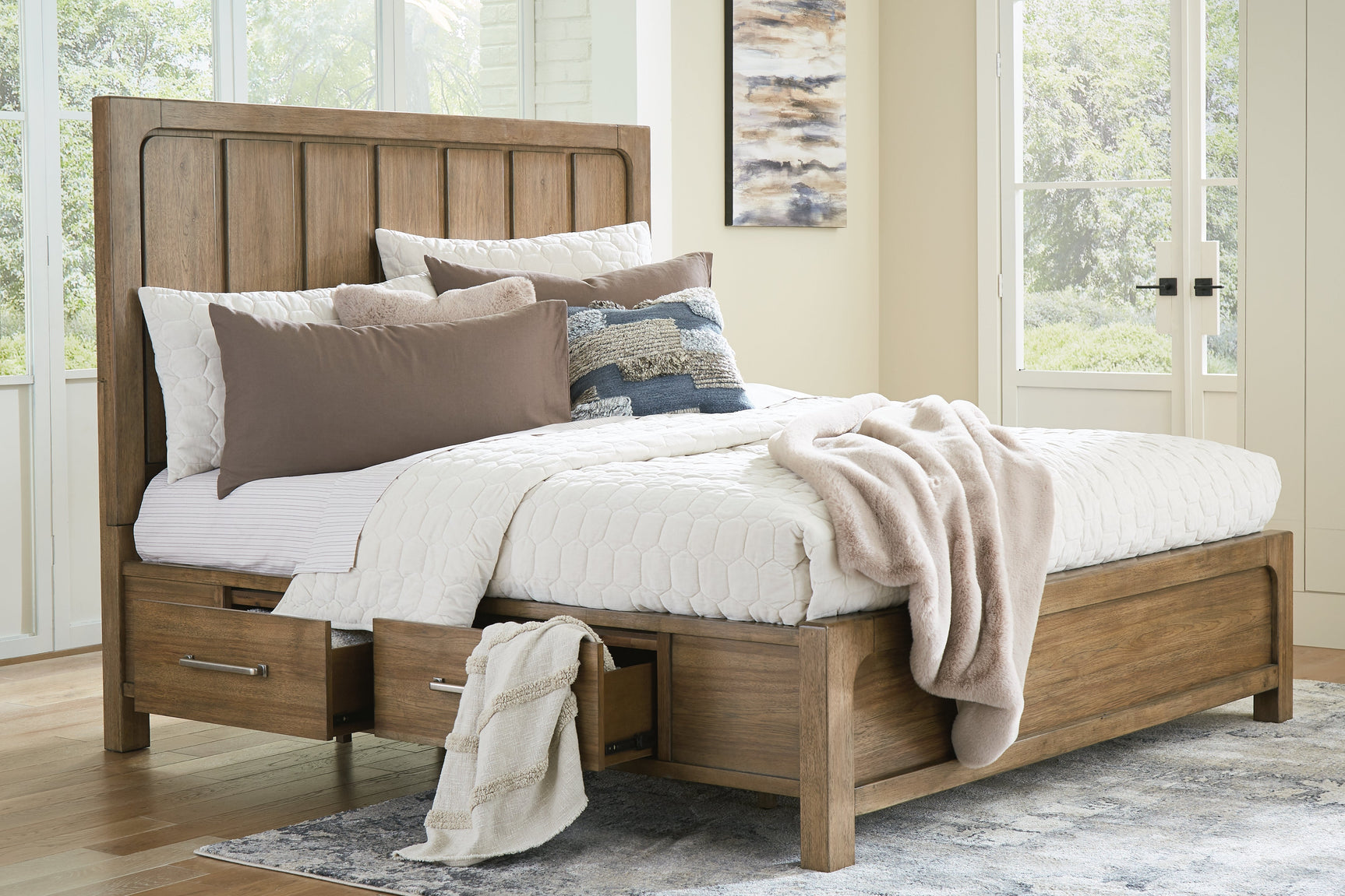 Open drawer detail with aged pewter hardware on Cabalynn Bed