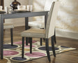 Kimonte Ivory Dining Chair front angle with black wood frame and ivory upholstery