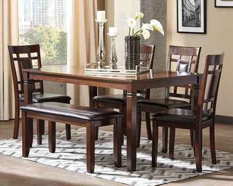 Bennox brown rectangular dining table with four upholstered chairs and bench