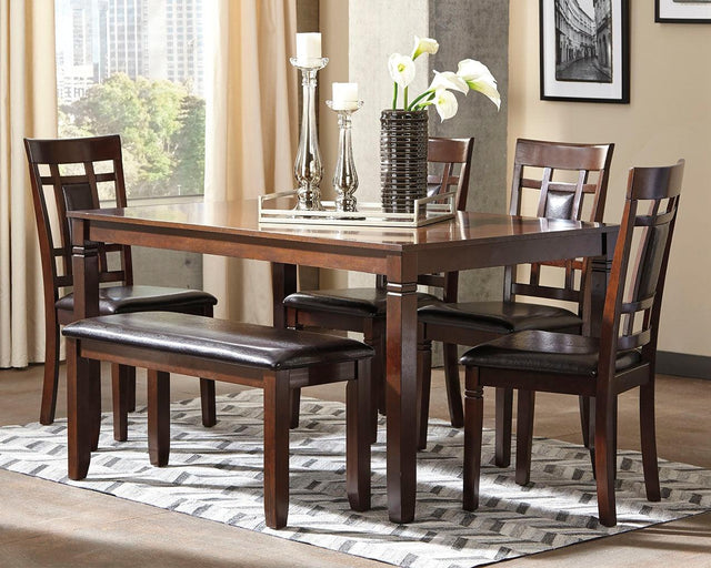 Bennox brown rectangular dining table with four upholstered chairs and bench