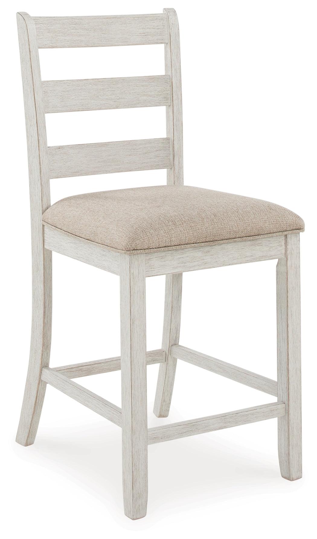 Bar stool close-up showing upholstery and ladderback detail