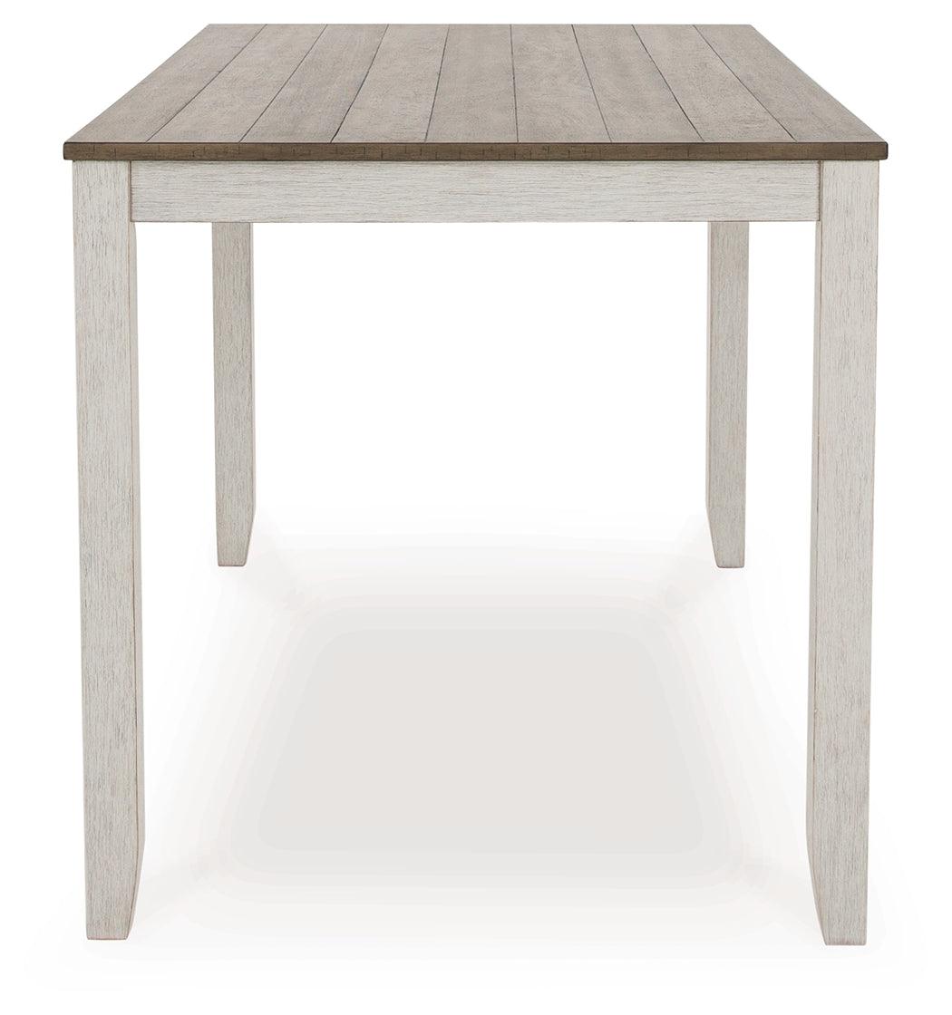 Side view of dining table showing leg base and top thickness
