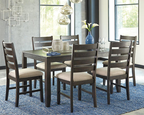 Rokane brown rectangular dining table with six upholstered chairs set in dining room