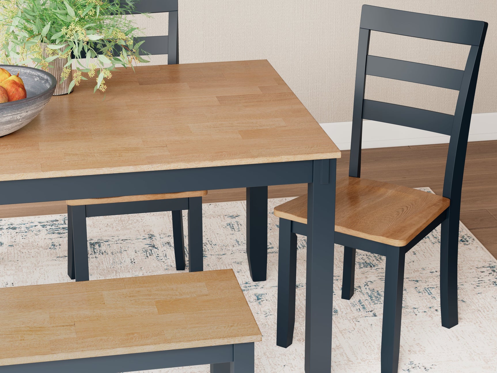 Close detail of Gesthaven dining table's wood texture and blue finish