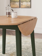 Detail of natural mango wood and green finish on Gesthaven table